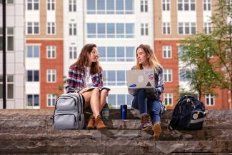 students sitting on steps
