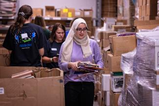 students volunteering in a warehouse